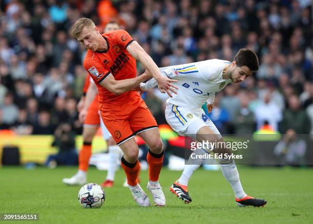 Zian Flemming of Millwall is challenged by Ilia Gruev of Leeds United during the Sky Bet Championship match between Leeds United and Millwall at...