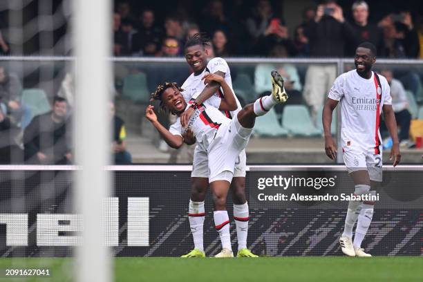 Samuel Chukwueze of AC Milan celebrates scoring his team's third goal with teammate Rafael Leao during the Serie A TIM match between Hellas Verona FC...