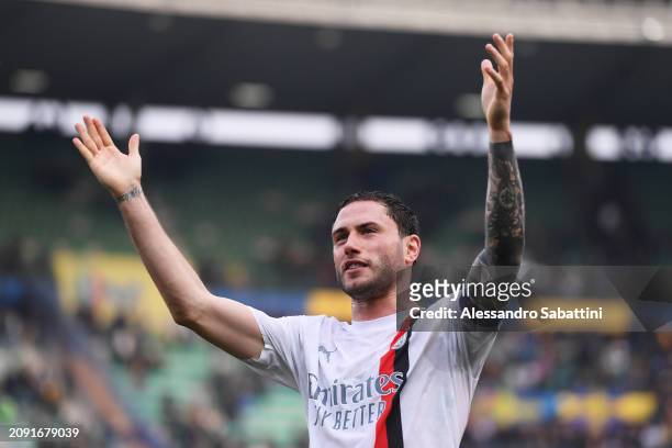 Davide Calabria of AC Milan celebrates with the fans after the team's victory during the Serie A TIM match between Hellas Verona FC and AC Milan at...