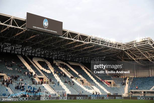 The LED screen inside the stadium displays a message of "match postponed to a later date" during the Serie A TIM match between Atalanta BC and ACF...