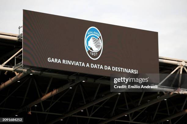 The LED screen inside the stadium displays a message of "match postponed to a later date" during the Serie A TIM match between Atalanta BC and ACF...