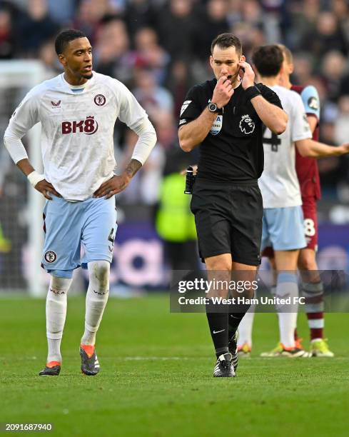 Referee Jarred Gillett takes the opportunity to go and view the VAR monitor during the Premier League match between West Ham United and Aston Villa...