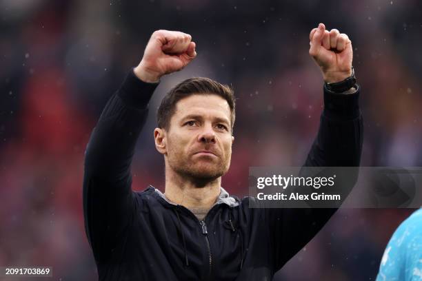 Xabi Alonso, Head Coach of Bayer Leverkusen, celebrates following the team's victory in the Bundesliga match between Sport-Club Freiburg and Bayer 04...