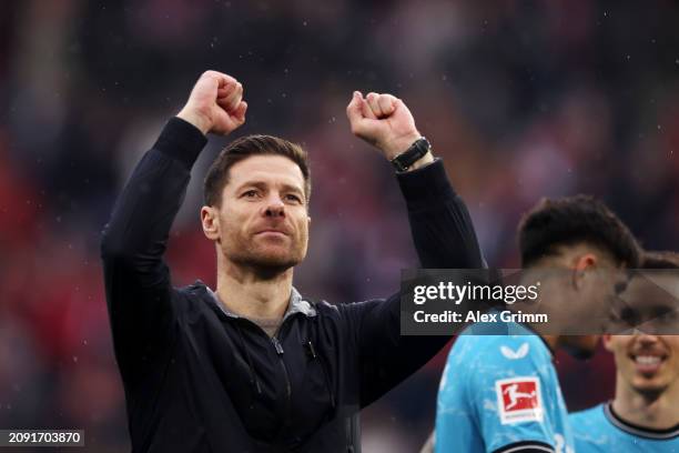 Xabi Alonso, Head Coach of Bayer Leverkusen, celebrates following the team's victory in the Bundesliga match between Sport-Club Freiburg and Bayer 04...