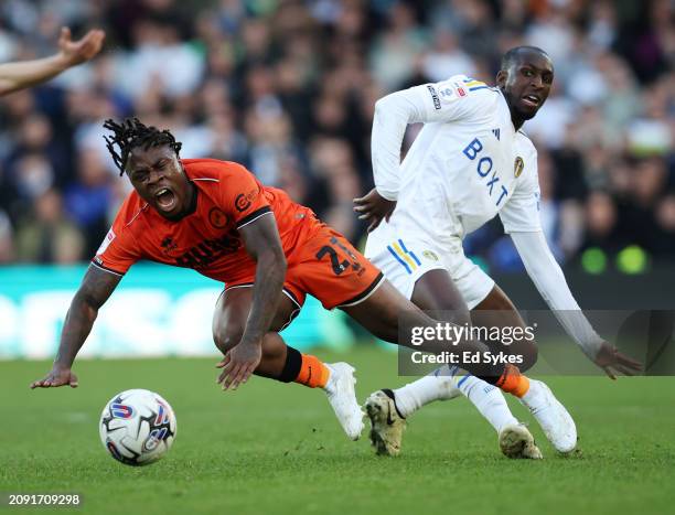 Michael Obafemi of Millwall is challenged by Glen Kamara of Leeds United during the Sky Bet Championship match between Leeds United and Millwall at...