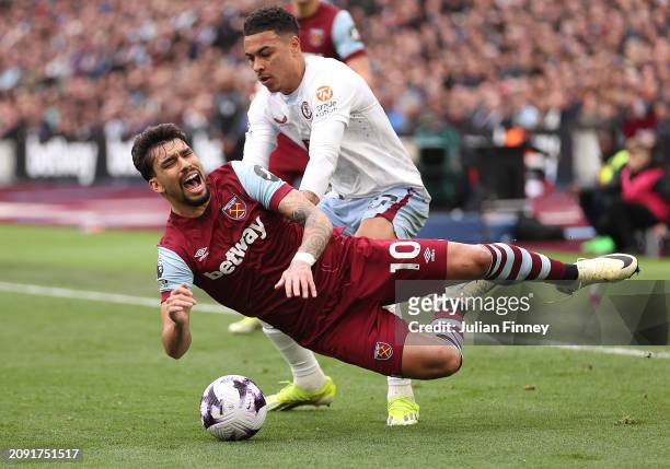 Lucas Paqueta of West Ham United is challenged by Morgan Rogers of Aston Villa during the Premier League match between West Ham United and Aston...