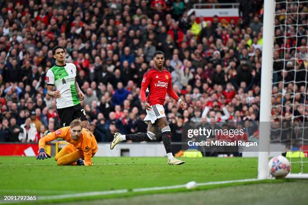 Marcus Rashford of Manchester United shoots and misses as Caoimhin Kelleher of Liverpool looks on after failing to make a save in the last minute...