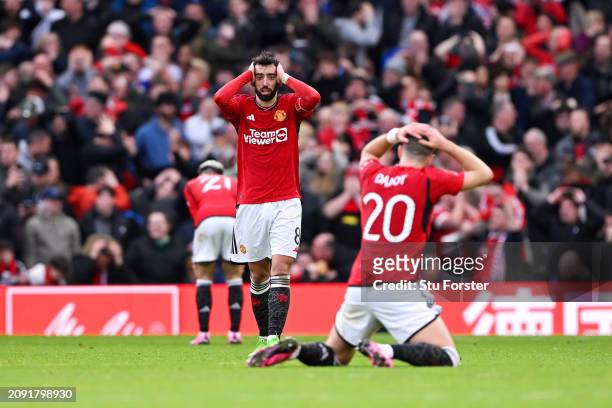 Bruno Fernandes and Diogo Dalot of Manchester United react after Marcus Rashford of Manchester United missing an opportunity in the last minute...