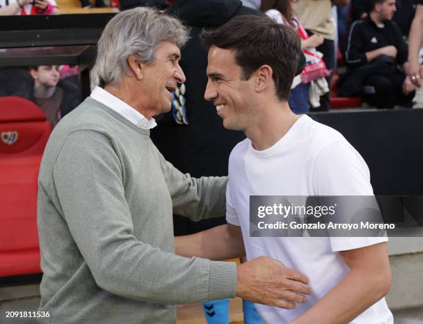 Manuel Pellegrini, Head Coach of Real Betis, interacts with Inigo Perez, Head Coach of Rayo Vallecano, during the LaLiga EA Sports match between Rayo...