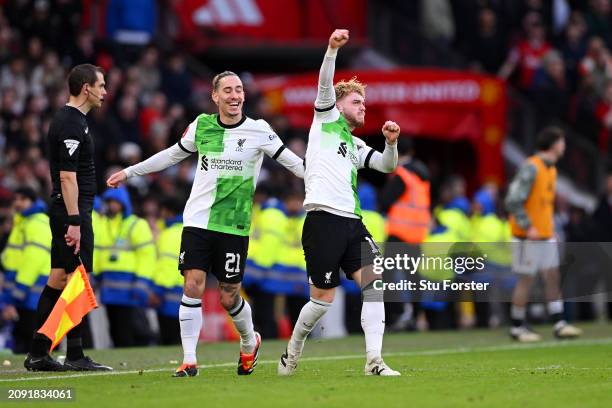 Harvey Elliott of Liverpool celebrates scoring his team's third goal with teammate Kostas Tsimikas during the Emirates FA Cup Quarter Final between...