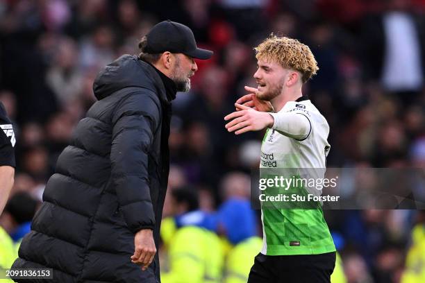 Harvey Elliott of Liverpool celebrates scoring his team's third goal with Jurgen Klopp, Manager of Liverpool, during the Emirates FA Cup Quarter...