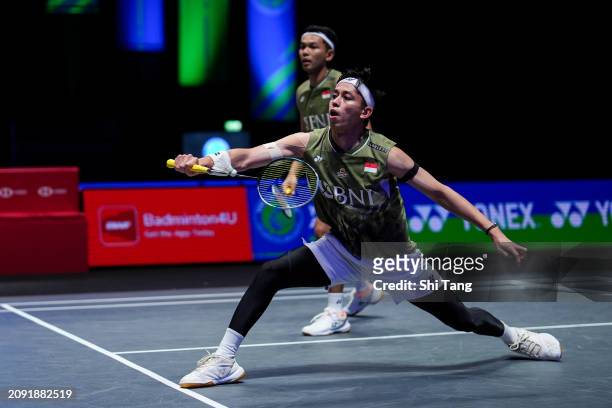 Fajar Alfian and Muhammad Rian Ardianto of Indonesia compete in the Men's Doubles Final match against Aaron Chia and Soh Wooi Yik of Malaysia during...
