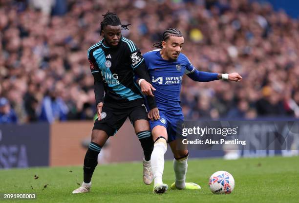 Stephy Mavididi of Leicester City tackles Malo Gusto of Chelsea during the Emirates FA Cup Quarter Final between Chelsea FC v Leicester City at...