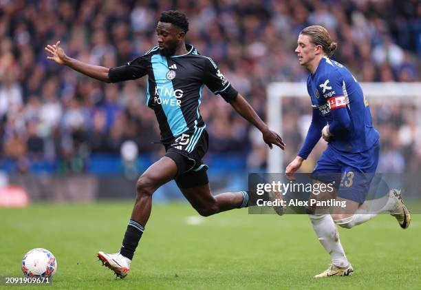 Wilfred Ndidi of Leicester City is chased by Conor Gallagher of Chelsea during the Emirates FA Cup Quarter Final between Chelsea FC v Leicester City...