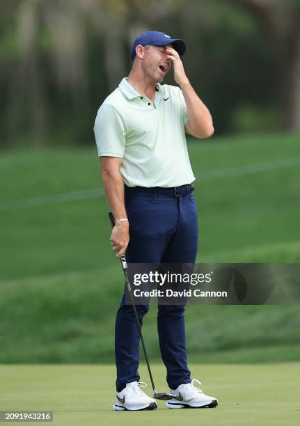 Rory McIlroy of Northern Ireland reacts to a missed putt on the first hole during the final round of THE PLAYERS Championship at TPC Sawgrass on...