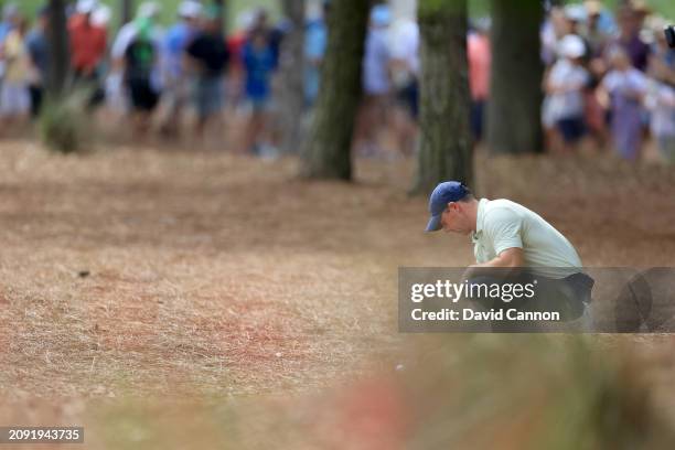 Rory McIlroy of Northern Ireland prepares to play his second shot on the first hole during the final round of THE PLAYERS Championship at TPC...