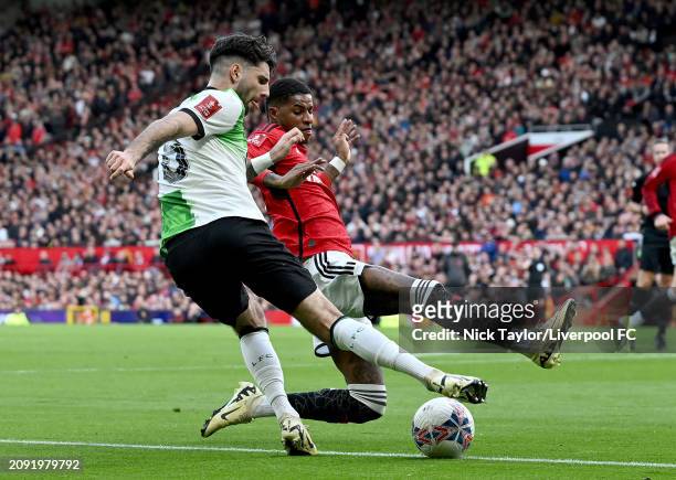 Dominik Szoboszlai of Liverpool and Marcus Rashford of Manchester United in action during the Emirates FA Cup Quarter Final at Old Trafford on March...