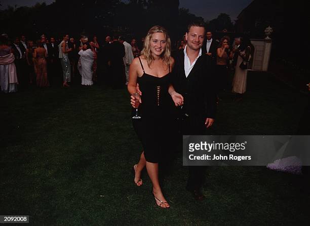 Actress Kate Winslet and husband Jim Threapleton at the White Tie and Tiara Ball held at Sir Elton John's Windsor mansion, England on July 5, 2001....