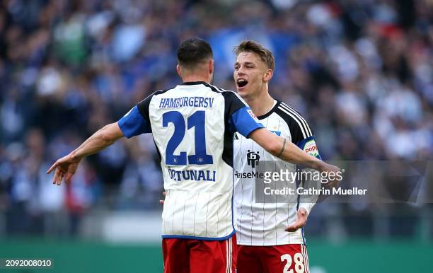 Miro Muheim of Hamburger SV celebrates scoring his team's first goal with teammate Levin Oeztunali during the Second Bundesliga match between...