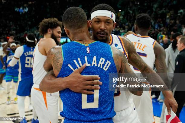 Damian Lillard of the Milwaukee Bucks and Bradley Beal of the Phoenix Suns hug after a game at Fiserv Forum on March 17, 2024 in Milwaukee,...