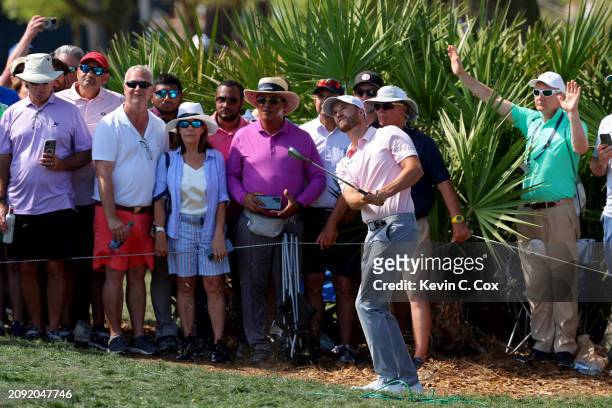Wyndham Clark of the United States plays a shot on the eighth hole during the final round of THE PLAYERS Championship at TPC Sawgrass on March 17,...