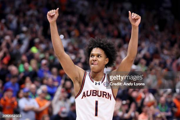 Aden Holloway of the Auburn Tigers celebrates against the Florida Gators during the second half of the SEC Tournament Championship game at...