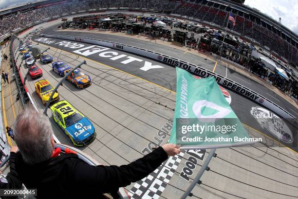 Ryan Blaney, driver of the Menards/Dutch Boy Ford, leads the field to the green flag to start the NASCAR Cup Series Food City 500 at Bristol Motor...