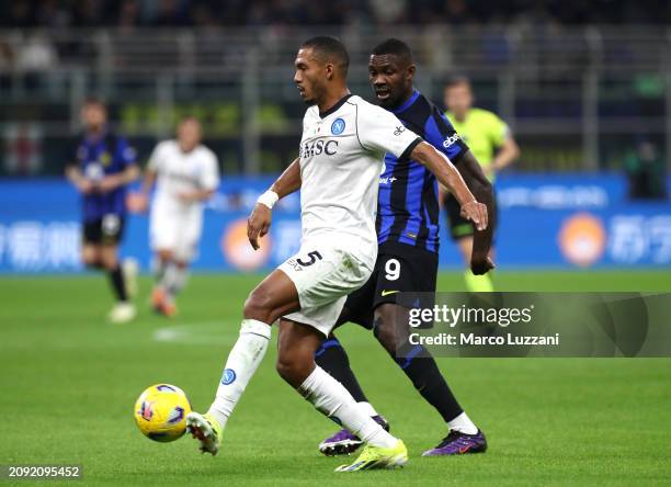 Juan Jesus of SSC Napoli is challenged by Marcus Thuram of FC Internazionale during the Serie A TIM match between FC Internazionale and SSC Napoli at...