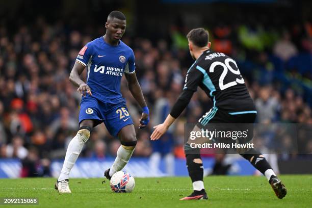 Moises Caicedo of Chelsea is challenged by Yunus Akgun of Leicester City during the Emirates FA Cup Quarter Final between Chelsea FC and Leicester...