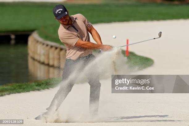 Xander Schauffele of the United States plays a shot from a bunker on the 11th hole during the final round of THE PLAYERS Championship at TPC Sawgrass...