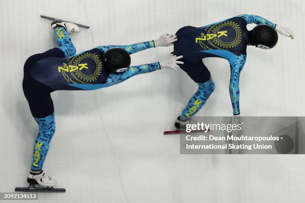 Denis Nikisha and Mersaid Zhaxybayev of Kazakhstan compete in the Men 5000m Relay Final B during ISU World Short Track Speed Skating Championships...