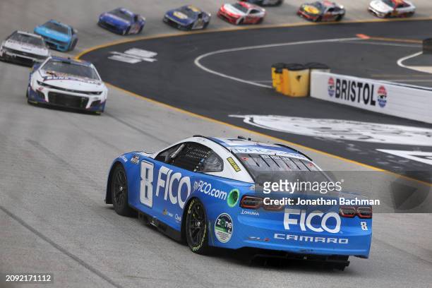 Kyle Busch, driver of the FICO Chevrolet, spins after an on-track incident during the NASCAR Cup Series Food City 500 at Bristol Motor Speedway on...