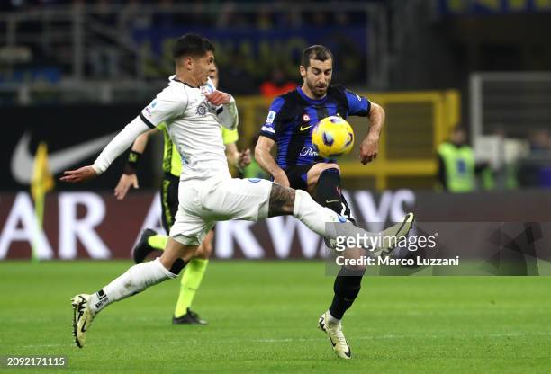Henrikh Mkhitaryan of FC Internazionale is challenged by Mathias Olivera of SSC Napoli during the Serie A TIM match between FC Internazionale and SSC...