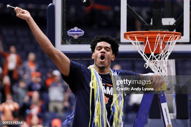 Dylan Cardwell of the Auburn Tigers celebrates after defeating the Florida Gators in the SEC Tournament Championship game at Bridgestone Arena on...