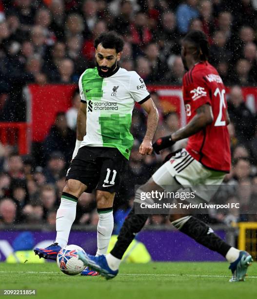 Mohamed Salah of Liverpool in action during the Emirates FA Cup Quarter Final at Old Trafford on March 17, 2024 in Manchester, England.