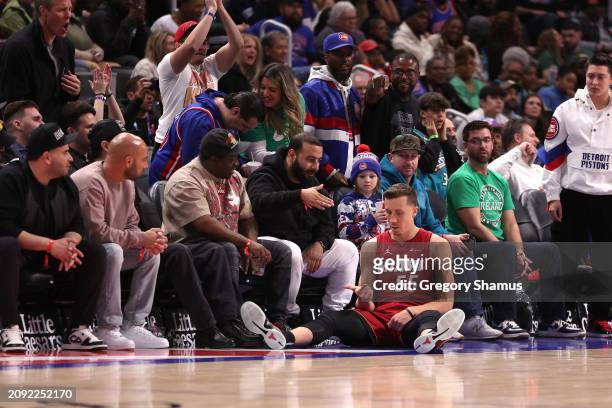Duncan Robinson of the Miami Heat counts on his fingers after hitting a late fourth quarter three point basket against the Detroit Pistons at Little...
