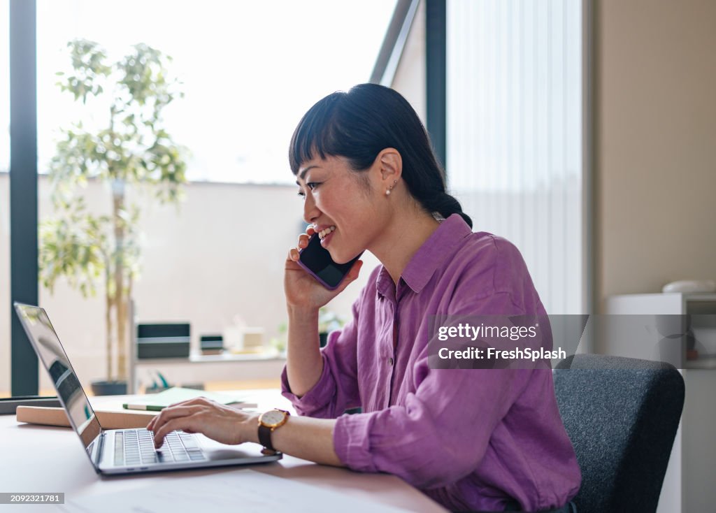 Professional Woman Engaged in Business Call at Modern Office