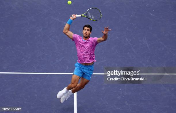 Carlos Alcaraz of Spain plays a smash against Daniil Medvedev in the Men's Final during the BNP Paribas Open at Indian Wells Tennis Garden on March...
