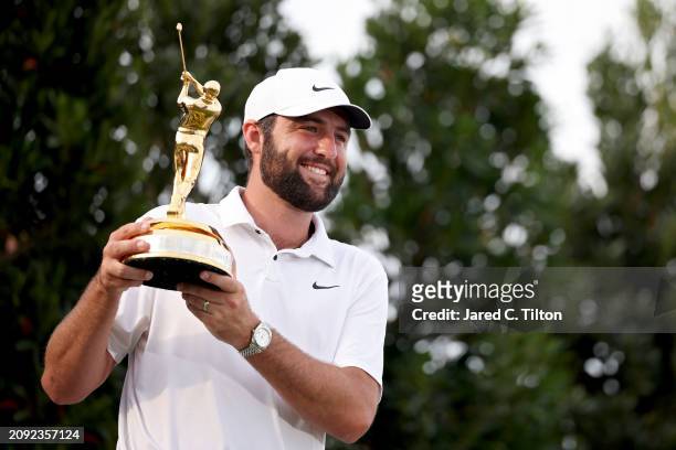 Scottie Scheffler of the United States celebrates with the trophy after winning during the final round of THE PLAYERS Championship at TPC Sawgrass on...
