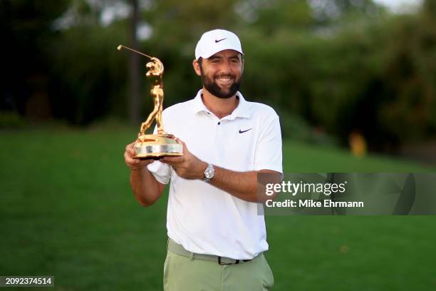 Scottie Scheffler of the United States poses with the trophy after winning THE PLAYERS Championship at TPC Sawgrass on March 17, 2024 in Ponte Vedra...