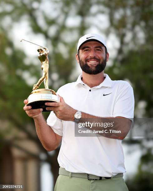 Scottie Scheffler of the United States poses with the trophy after winning THE PLAYERS Championship at TPC Sawgrass on March 17, 2024 in Ponte Vedra...