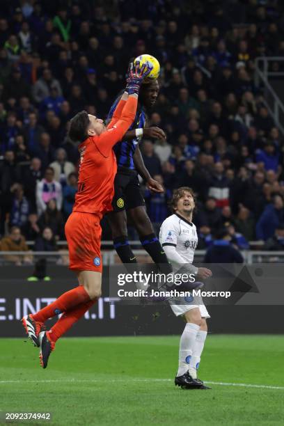 Mario Rui of SSC Napoli looks on as teammate Alex Meret clashes with Marcus Thuram of FC Internazionale as he attempts to catch an aerial ball during...