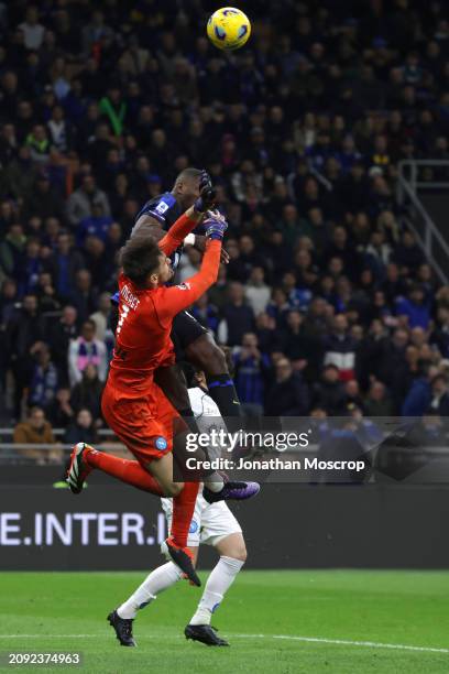 Mario Rui of SSC Napoli looks on as teammate Alex Meret clashes with Marcus Thuram of FC Internazionale as he attempts to catch an aerial ball during...