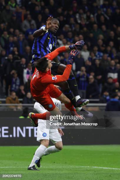 Mario Rui of SSC Napoli looks on as teammate Alex Meret clashes with Marcus Thuram of FC Internazionale as he attempts to catch an aerial ball during...