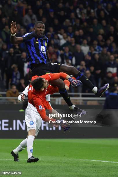 Mario Rui of SSC Napoli looks on as teammate Alex Meret clashes with Marcus Thuram of FC Internazionale as he attempts to catch an aerial ball during...