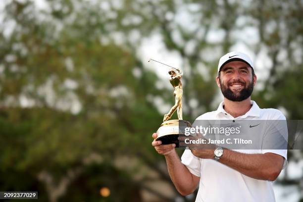 Scottie Scheffler of the United States poses with the trophy after winning THE PLAYERS Championship at TPC Sawgrass on March 17, 2024 in Ponte Vedra...