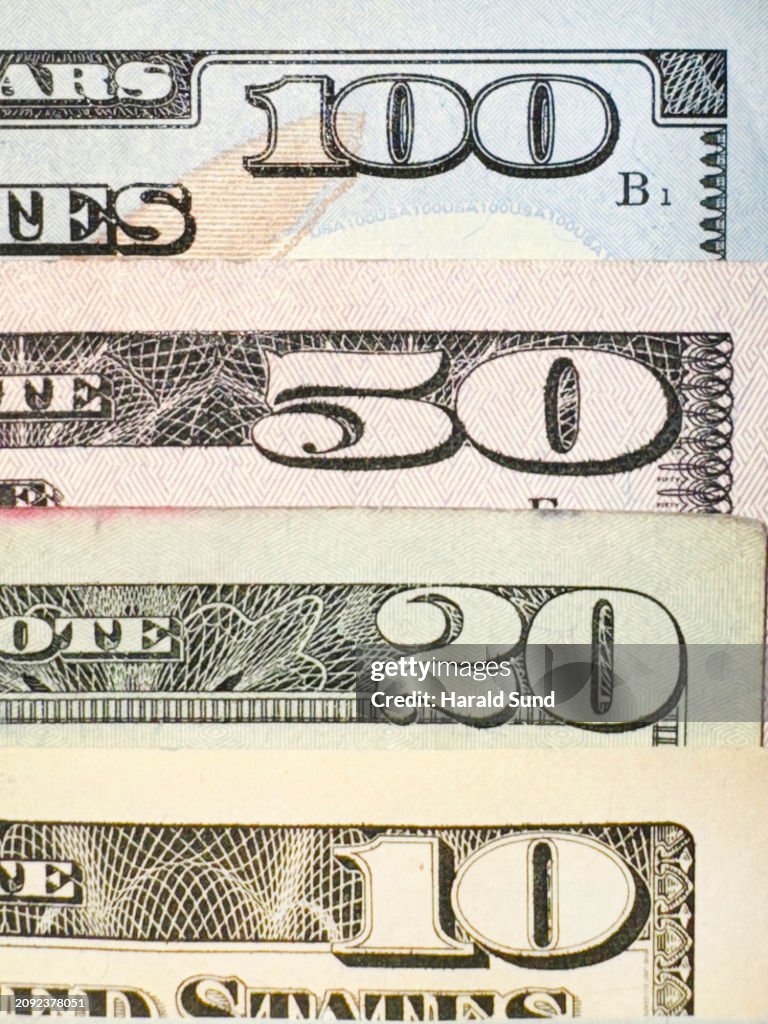 Close-up, US paper currency, 100, fifty, twenty and 10 dollar bills