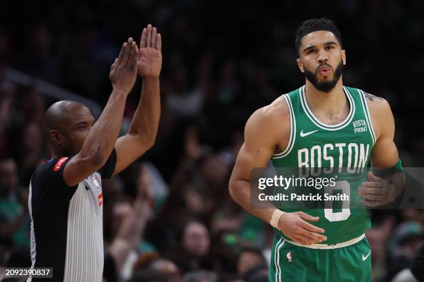 Jayson Tatum of the Boston Celtics celebrates after scoring a three-point basket against the Washington Wizards during the first half at Capital One...