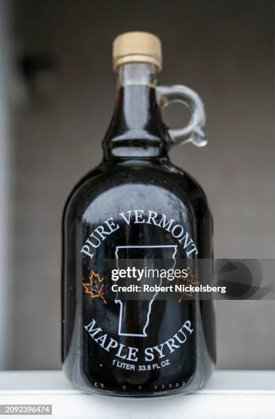 Half gallon bottle of freshly made maple syrup is seen on a porch March 10, 2024 in Ferrisburgh, Vermont. Through a boiling process, it normally...