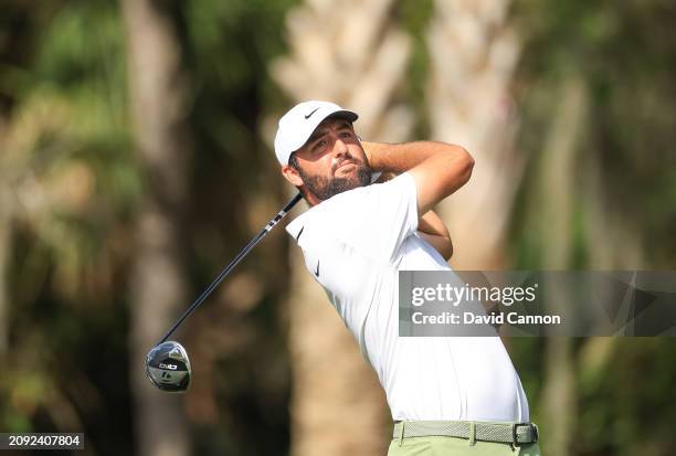 Scottie Scheffler of The United States plays his tee shot on the 14th hole during the final round of THE PLAYERS Championship at TPC Sawgrass on...